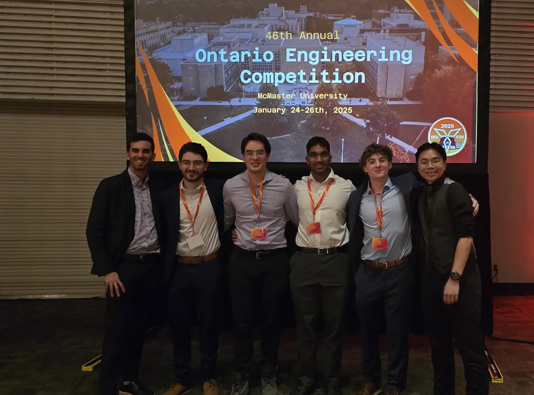 Myself, my co-lead, and one of the winning teams at the competition